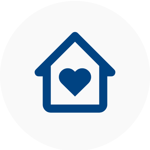 Blue house icon with a heart in the center on a white background representing Aged Care