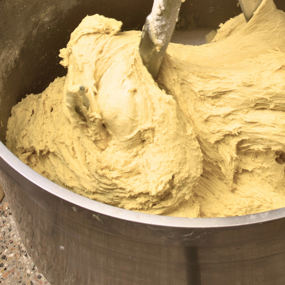 Mixing dough in a large bakery restaurant mixer 