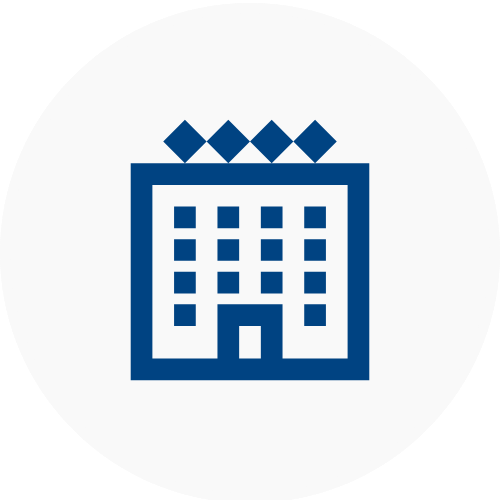 Blue icon of a hotel building on a white background