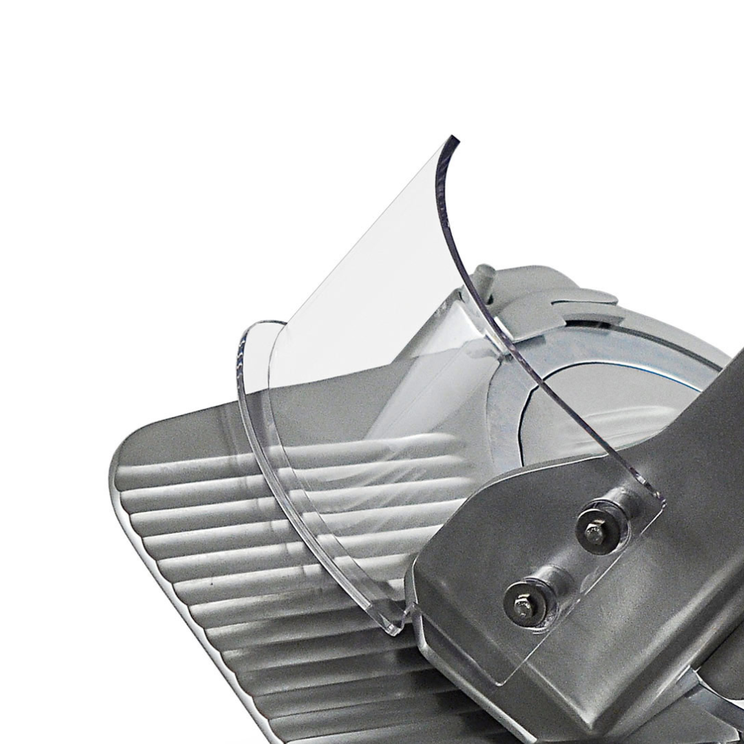 Close up of meat slicer guard on heavy duty slicer