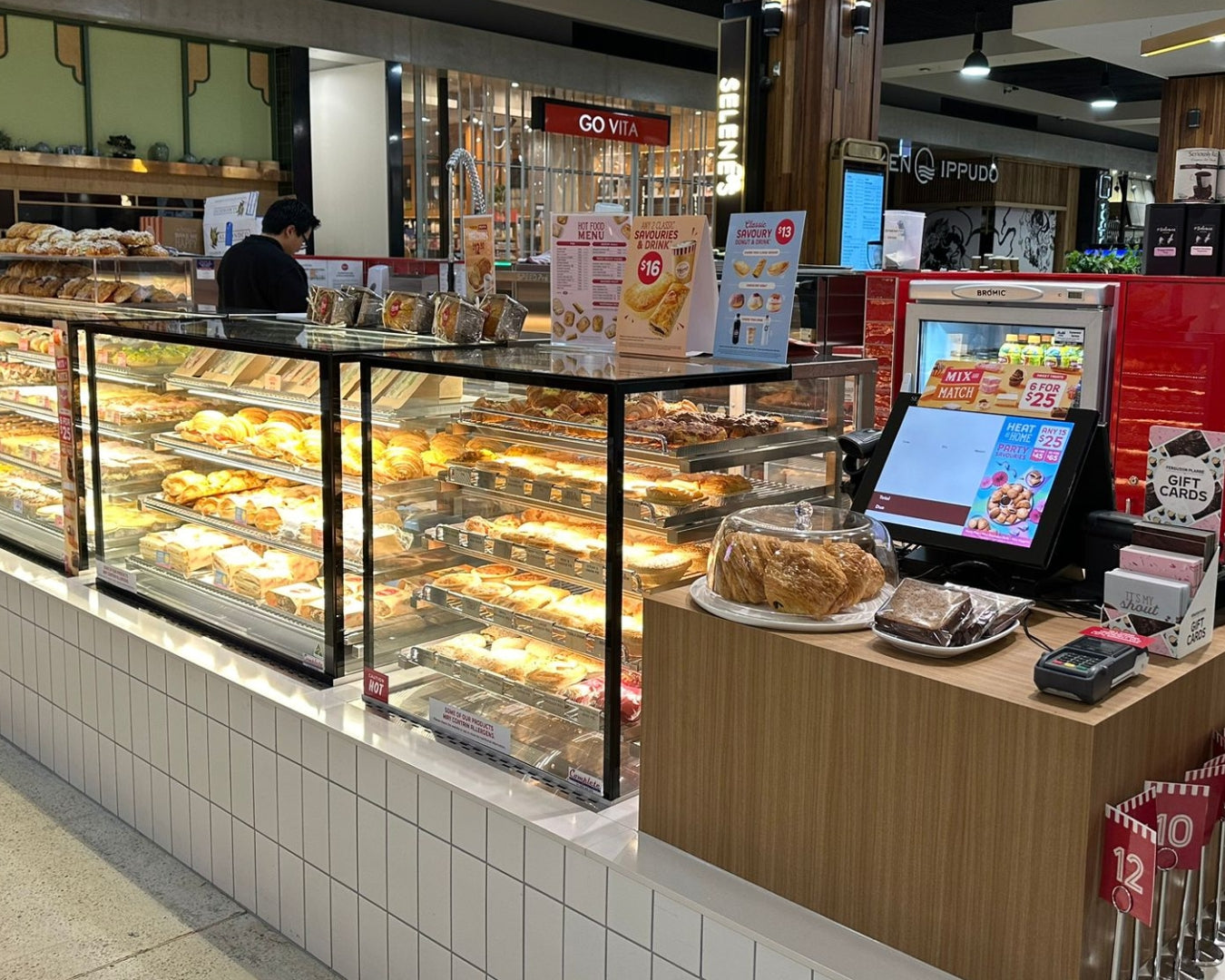 Bakery cafe heated display counters filled with pies and pastries 